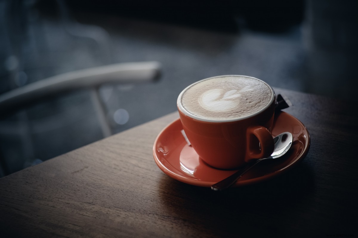 Why should you avoid reheating your coffee in the microwave? 